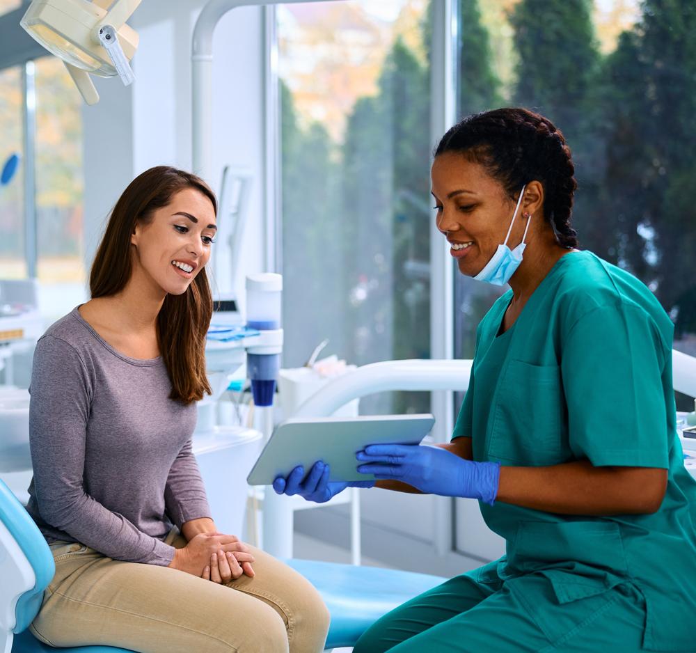 Dentist talking to patient